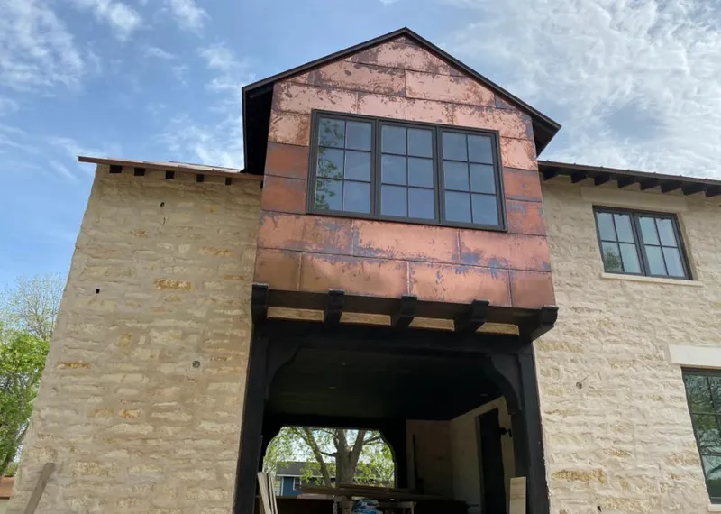 Copper metal panel facade on a stone building for Skylight Installation in Rocklin