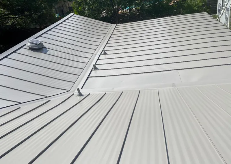 Solar attic fan installed on a metal roof for Roof Ventilation in Rocklin